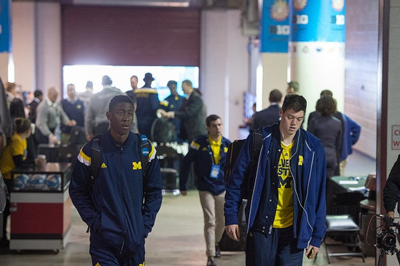 Caris LeVert (23) and Ricky Doyle (32)