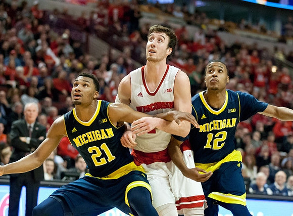 Zak Irvin (21) and Muhammad-Ali Abdur-Rahkman (12)