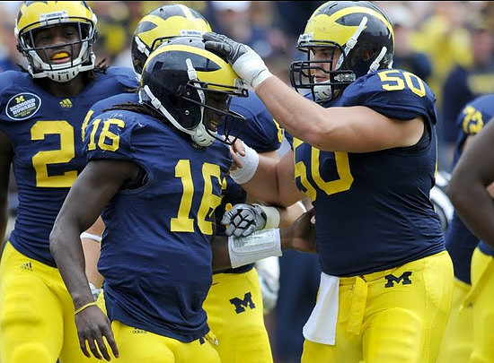 Vincent Smith (2), Denard Robinson (16), and David Molk (50)
