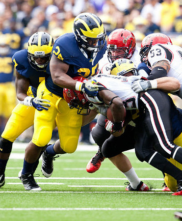 Brandin Hawthorne (7) and Kenny Demens (25)