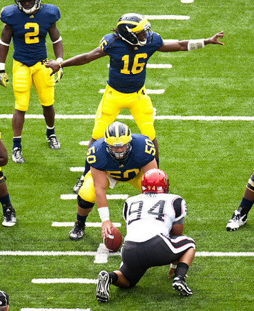 Vincent Smith (2), Denard Robinson (16), and David Molk (50)