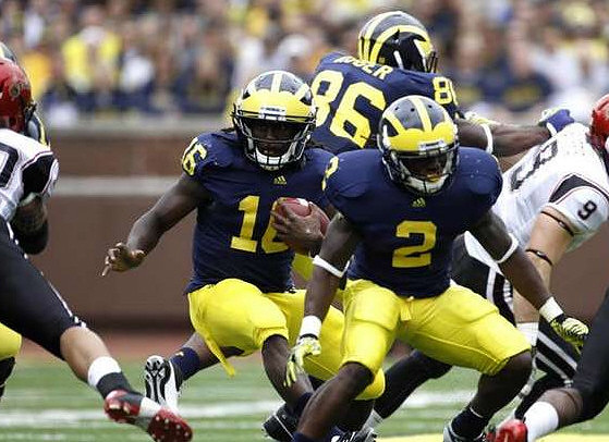 Vincent Smith (2), Denard Robinson (16), and Kevin Koger (86)
