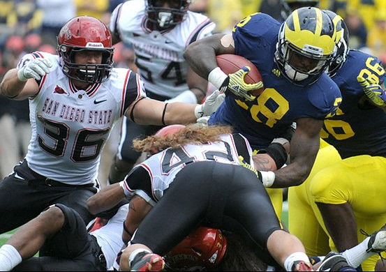 Fitzgerald Toussaint (28) and Kevin Koger (86)