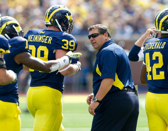 Will Heininger (39), Brady Hoke, and Roy Roundtree (12)