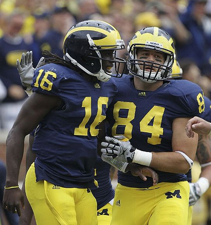 Denard Robinson (16) and Steve Watson (84)