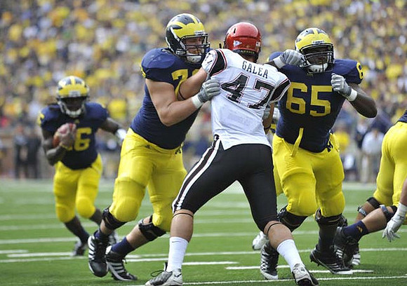 Denard Robinson (16), Mark Huyge (72), and Patrick Omameh (65)