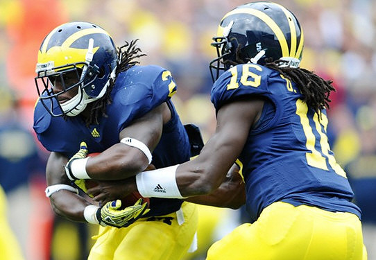 Vincent Smith (2) and Denard Robinson (16)
