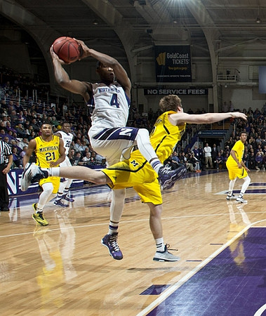 Zak Irvin (21), Spike Albrecht (2), and Aubrey Dawkins (24)