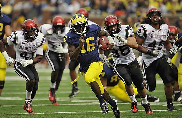 Denard Robinson (16) and Steve Watson (84)