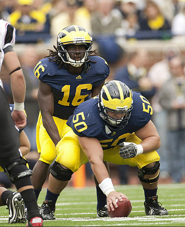 Denard Robinson (16) and David Molk (50)