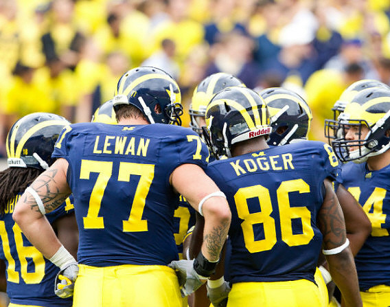 Denard Robinson (16), Taylor Lewan (77), and Kevin Koger (86)