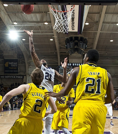 Spike Albrecht (2), Muhammad-Ali Abdur-Rahkman (12), and Zak Irvin (21)