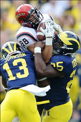 Carvin Johnson (13) and Kenny Demens (25)