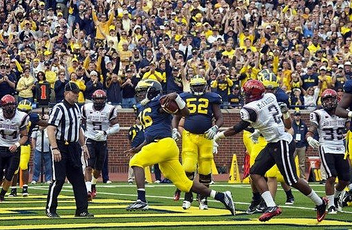 Denard Robinson (16) and Ricky Barnum (52)