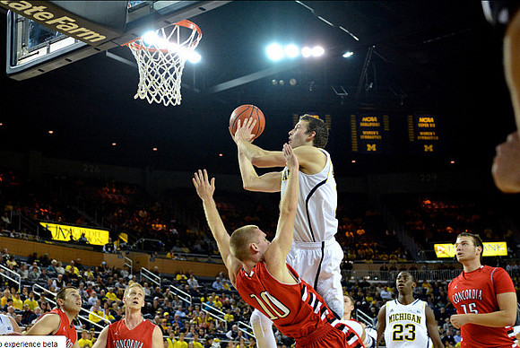 Nik Stauskas (11) and Caris LeVert (23)