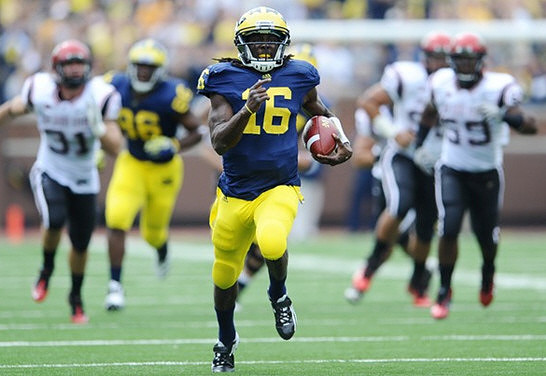 Denard Robinson (16) and Kevin Koger (86)