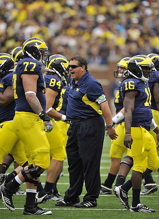 Taylor Lewan (77),  Steve Watson (84), Brady Hoke, and Denard Robinson (16)