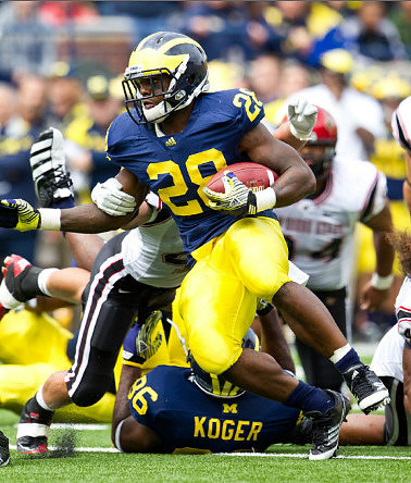 Fitzgerald Toussaint (28) and Kevin Koger (86)