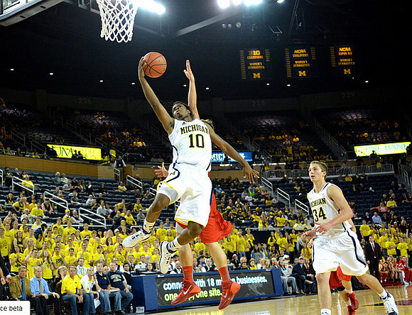 Derrick Walton Jr. (10) and Mark Donnal (34)