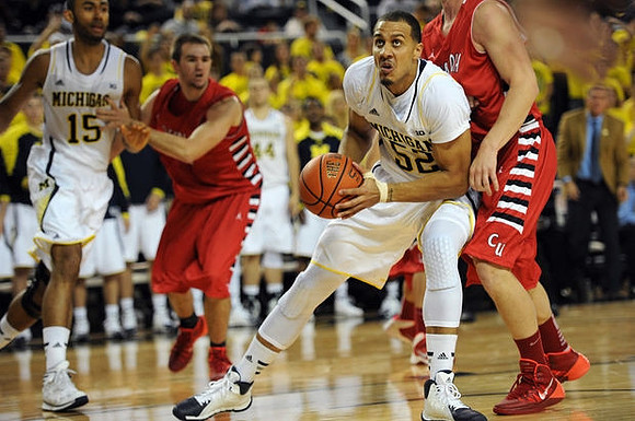 Jon Horford (15) and Jordan Morgan (52)