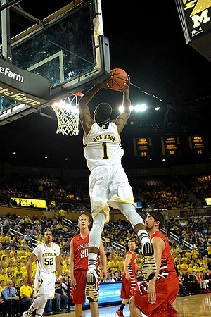 Glenn Robinson III (1) and Jordan Morgan (52)