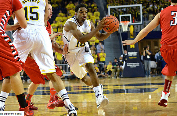 Jon Horford (15) and Derrick Walton Jr. (10)