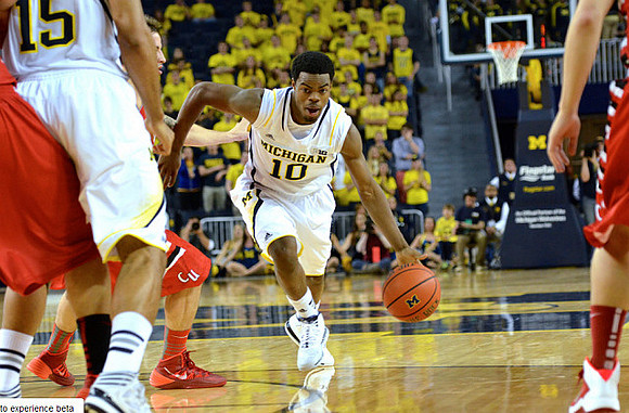 Jon Horford (15) and Derrick Walton Jr. (10)