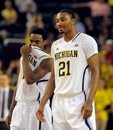 Derrick Walton Jr. (10) and Zak Irvin (21)