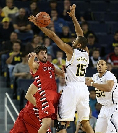 Jon Horford (15) and Jordan Morgan (52)