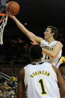 Glenn Robinson III (1) and Nik Stauskas (11)