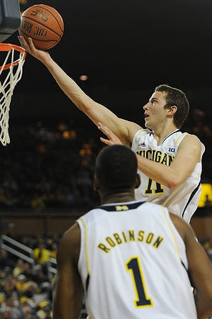 Glenn Robinson III (1) and Nik Stauskas (11)