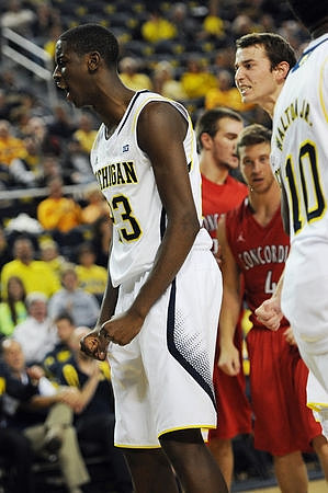 Caris LeVert (23), Derrick Walton Jr. (10), and Nik Stauskas (11)
