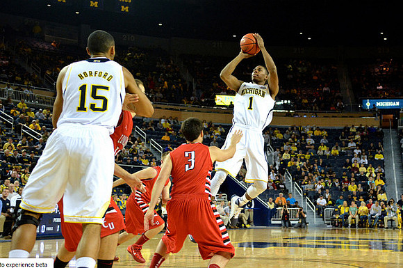 Jon Horford (15) and Glenn Robinson III (1)