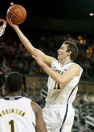 Glenn Robinson III (1) and Nik Stauskas (11)