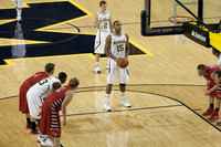 Jon Horford (15), Spike Albrecht (2), and Caris LeVert (23)