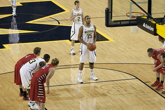 Jon Horford (15), Spike Albrecht (2), and Caris LeVert (23)