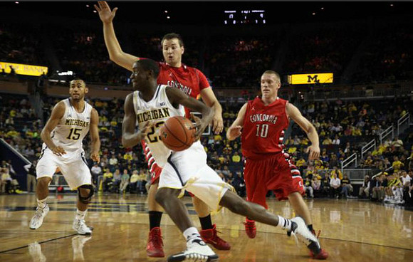 Jon Horford (15) and Caris LeVert (23)
