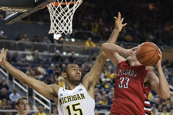 Jon Horford (15) and Nik Stauskas (11)