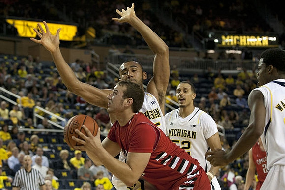Jon Horford (15), Jordan Morgan (52), and Derrick Walton Jr. (10)