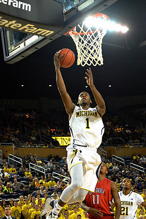 Glenn Robinson III (1) and Zak Irvin (21)