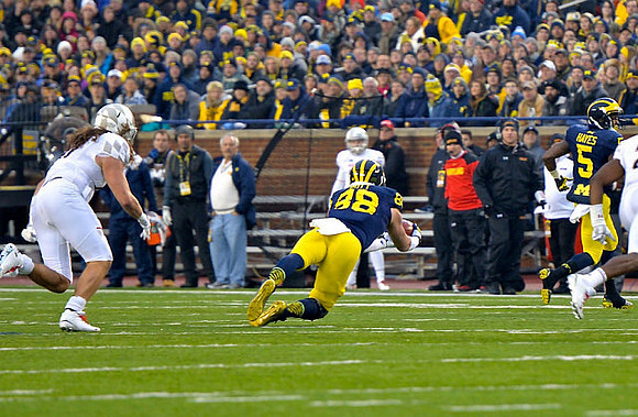 Jake Butt (88) and Justice Hayes (5)