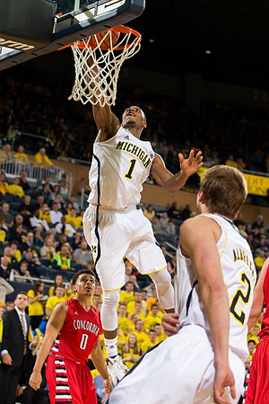 Glenn Robinson III (1) and Spike Albrecht (2)