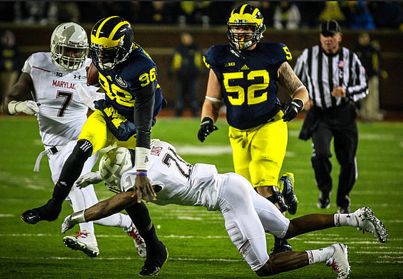 Devin Gardner (98) and Mason Cole (52)