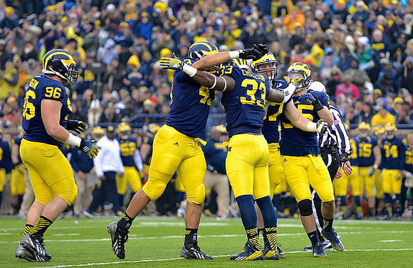 Ryan Glasgow (96), Chris Wormley (43), Taco Charlton (33), Brennen Beyer (97), and Joe Bolden (35)