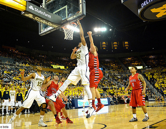 Jon Horford (15) and Jordan Morgan (52)