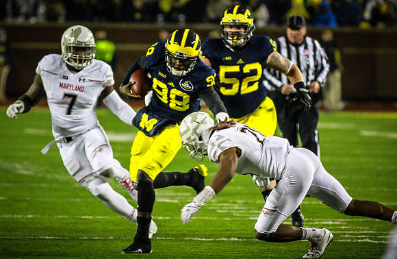 Devin Gardner (98) and Mason Cole (52)