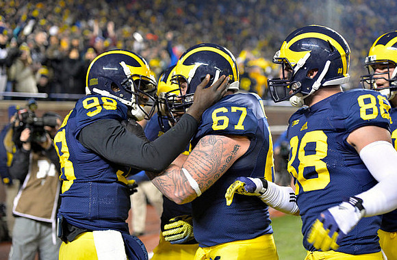 Devin Gardner (98), Kyle Kalis (67), and Jake Butt (88)
