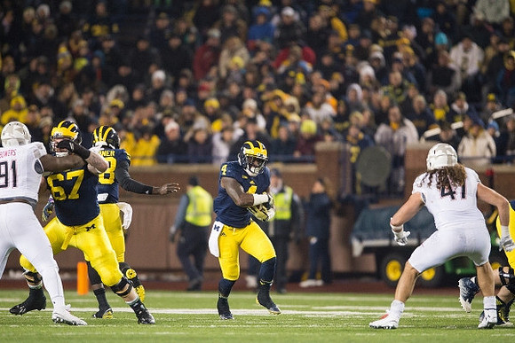 Kyle Kalis (67), Devin Gardner (98), and De'Veon Smith (4)