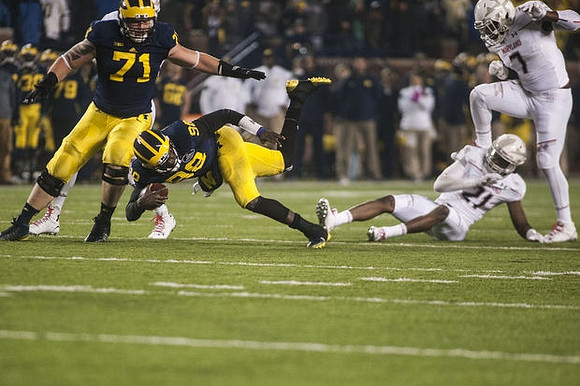 Ben Braden (71) and Devin Gardner (98)