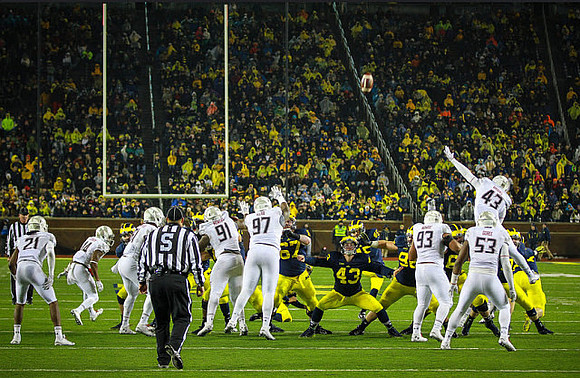 Kyle Kalis (67), Chris Wormley (43), and Ryan Glasgow (96)